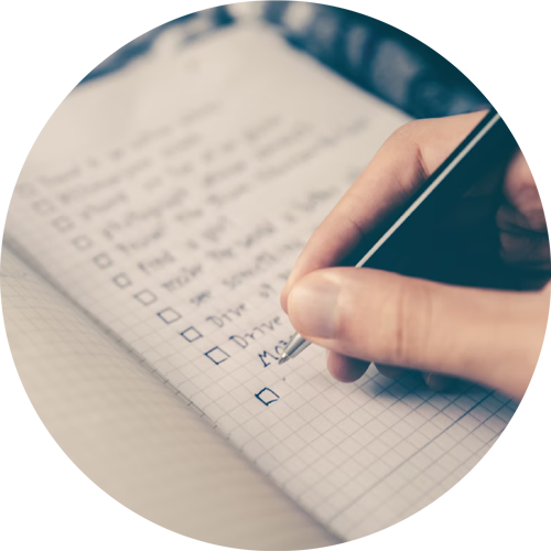 Writing a plan list in a journal.
